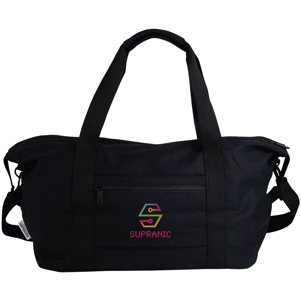 A black recycled canvas sports bag sits atop a silver suitcase, featuring a logo and sturdy handles.