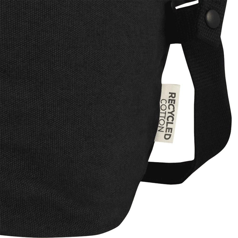 A black recycled canvas sports bag with dual handles and a removable shoulder strap. Features a logo on the side.