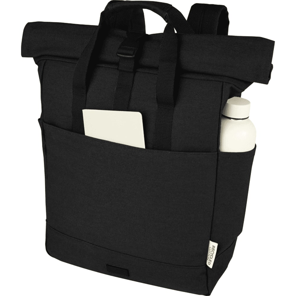 A black recycled canvas backpack tote featuring a logo, carried on a person’s back.