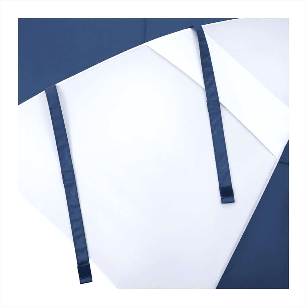 A recycled golf umbrella in navy and white with ties for securing the fabric when closed. Features a branding logo.