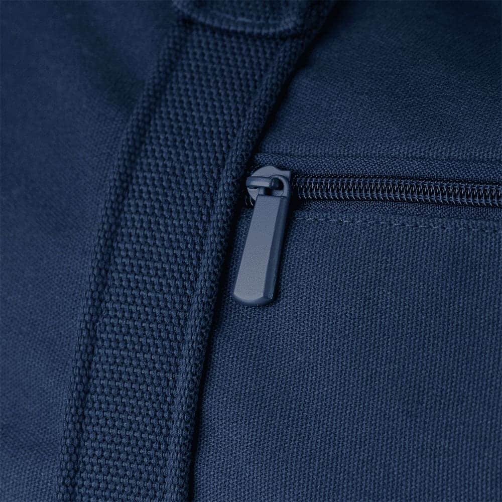 A navy blue duffel bag with dual handles, adjustable shoulder strap, and a front zipper pocket. It features a logo.