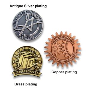 A collection of three die cast zinc alloy lapel pins with antique silver, copper, and brass plating, featuring different designs.