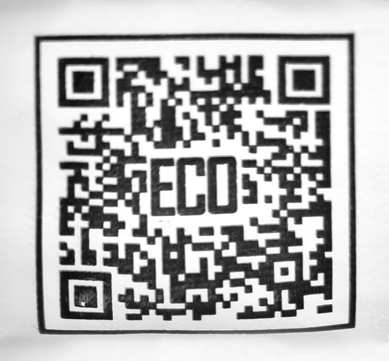 A black and white QR code with 