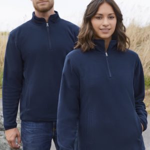 A navy fleece jacket featuring a half-zip design, displayed on both male and female models in an outdoor setting.