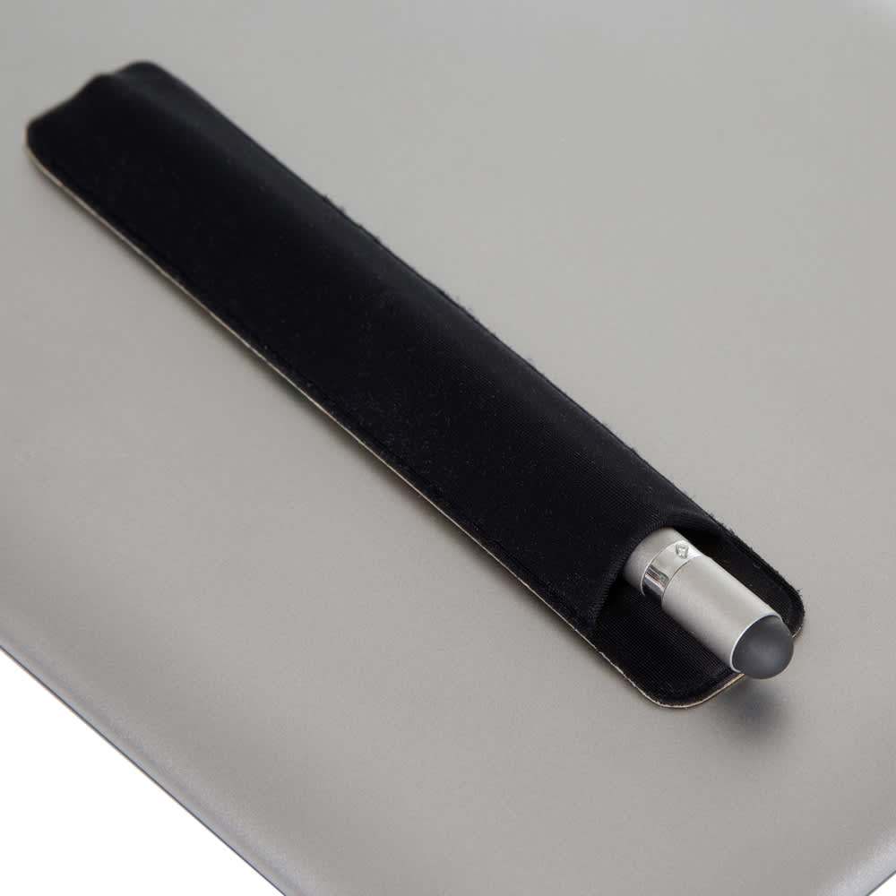 A metal pen in a black holder, placed on a grey surface, featuring a silver clip and end.