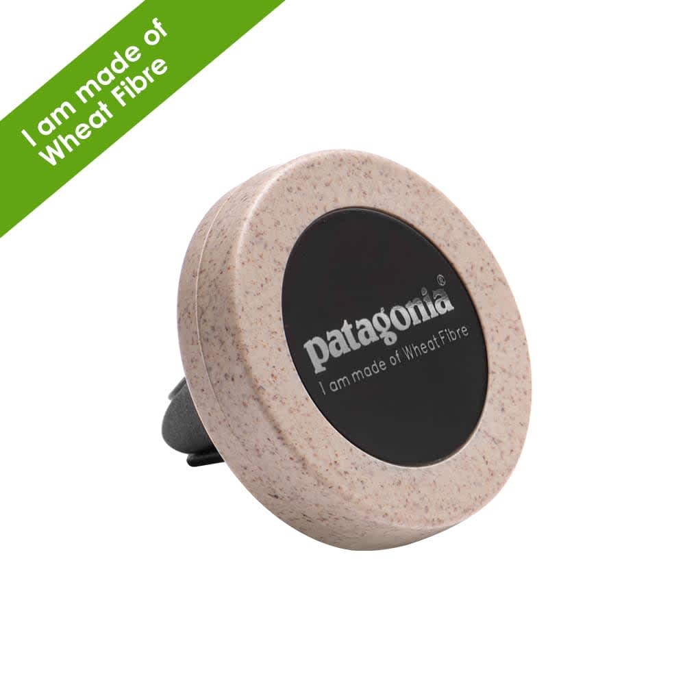 A round car vent mount in beige and black, made from plant fibres, featuring a logo on its surface.