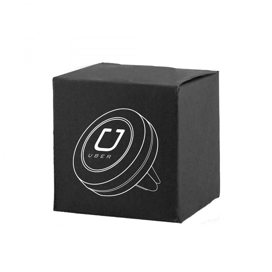 A black box containing a circular magnetic car mount with a logo on the top.