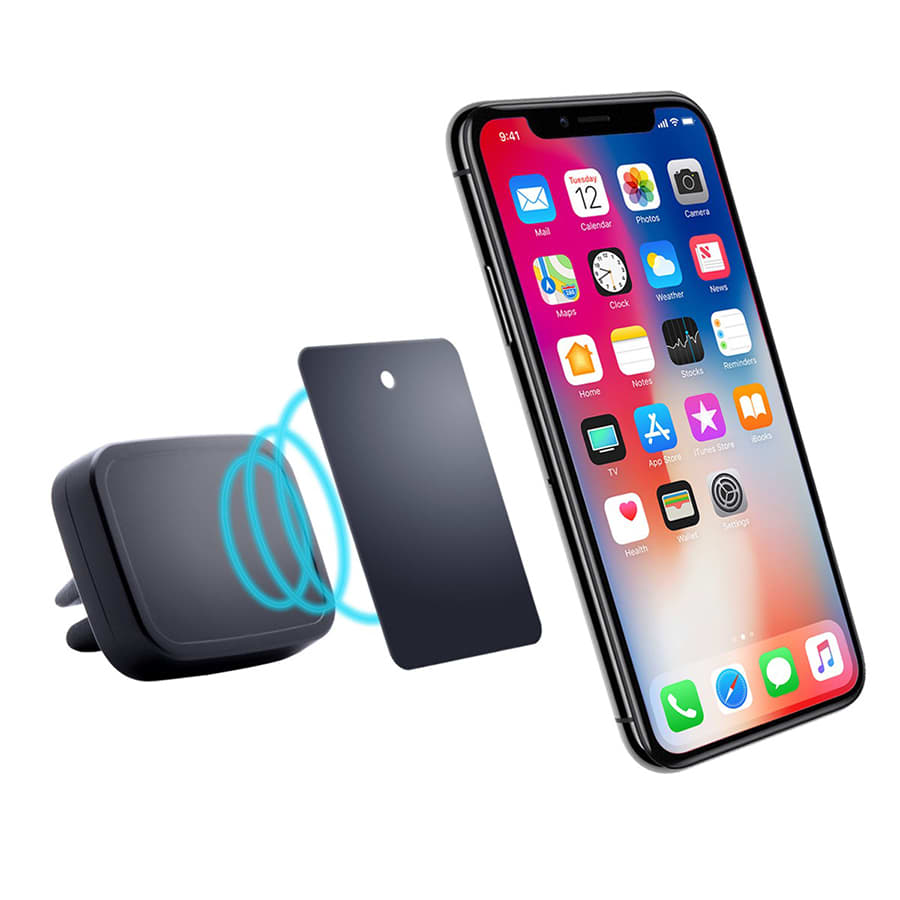 A black magnetic car mount next to a smartphone displaying various apps, with a metal plate nearby.