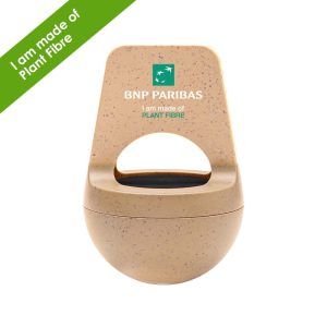 A tan wireless speaker made from plant fibre, featuring a handle and a logo on the front.