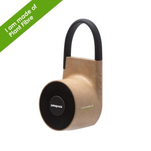 A Tuba wireless outdoor speaker in a natural plant fibre finish with a black handle and speaker grille, featuring a logo.