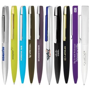 A collection of slim metal ballpoint pens in various colours, featuring multiple brands and a logo on each pen.