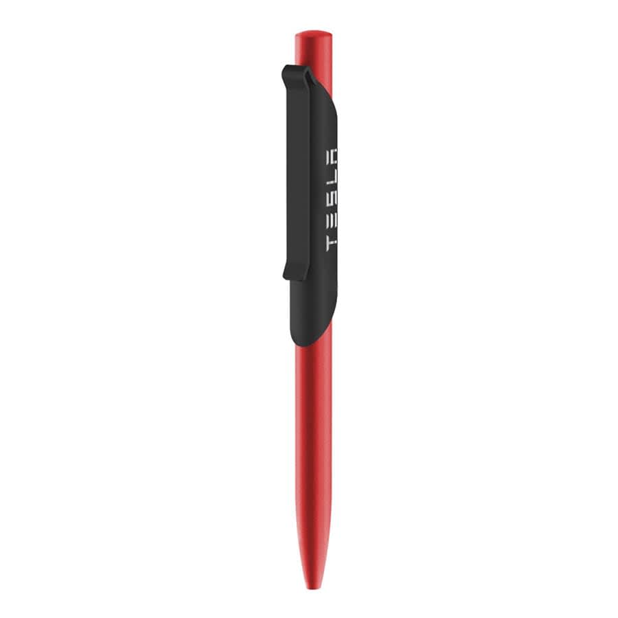 A red metal ballpoint pen with a black clip and branding, designed for writing.