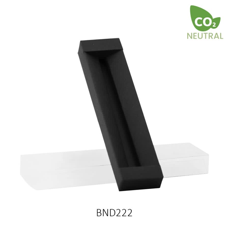 A sleek black metal pen displayed on a clear base, featuring a minimalist design.