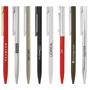 A selection of metal ball pens in various colours including red, black, silver, white, and green, with different logos.