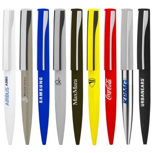 A collection of metal ball pens in various colours, featuring sleek designs and branding logos.