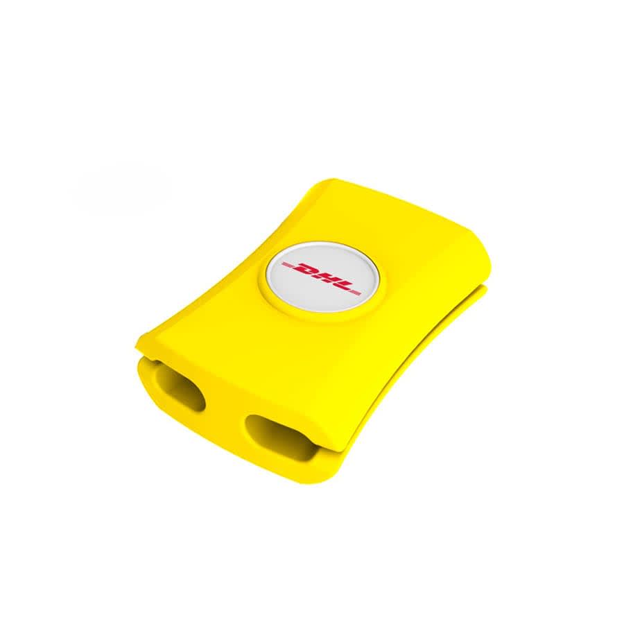 A yellow cable manager with two slots and a circular logo on top. Ideal for keeping cables tidy.