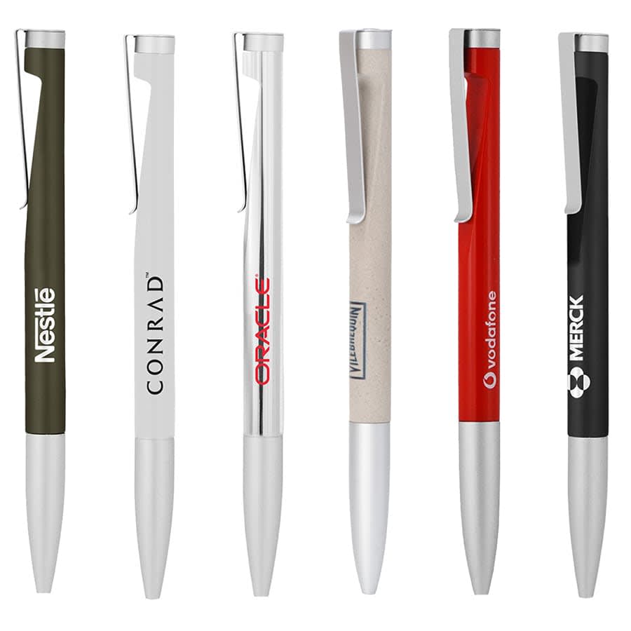 A collection of six metal ballpoint pens in various colours including olive green, white, silver, beige, red, and black, with branding.