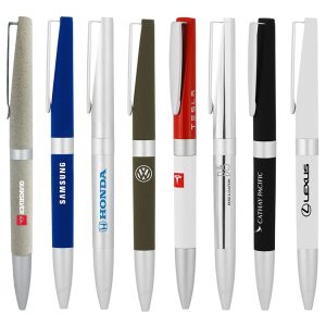 A collection of eight metal ball pens in various colours, featuring logos on some aspects.