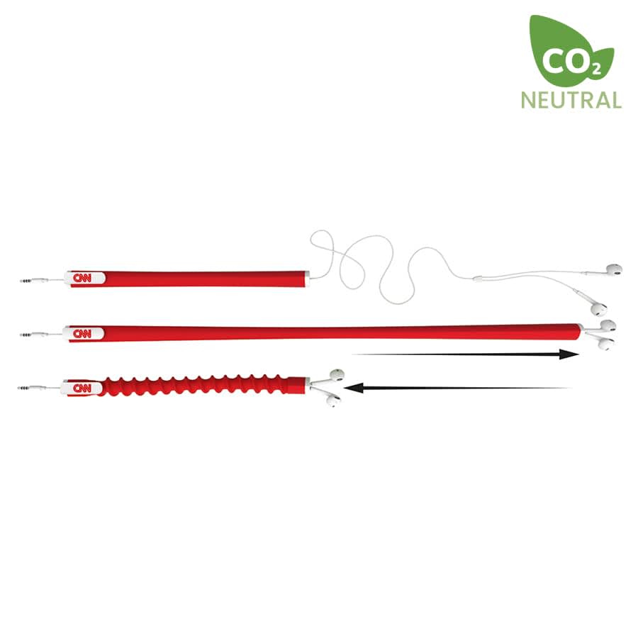 A red earbud organiser with multiple sections for tidying cables, featuring a logo on one end.