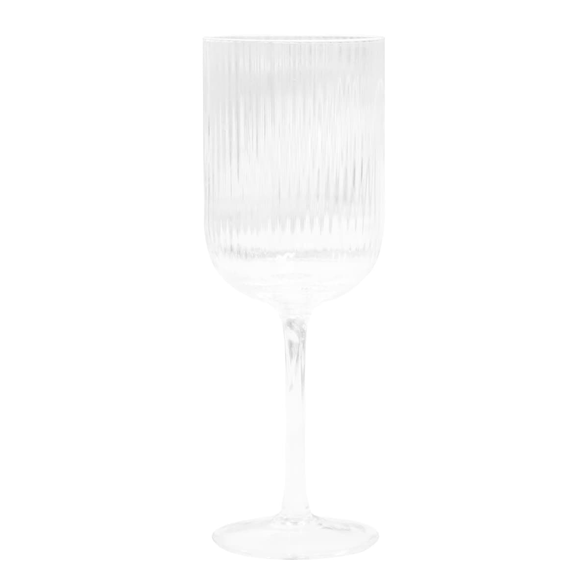 A ribbed clear glass wine glass with a stylish fluted design, standing on a thin stem.