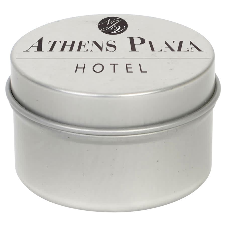 A silver tin candle with a lid, featuring a logo and the text 