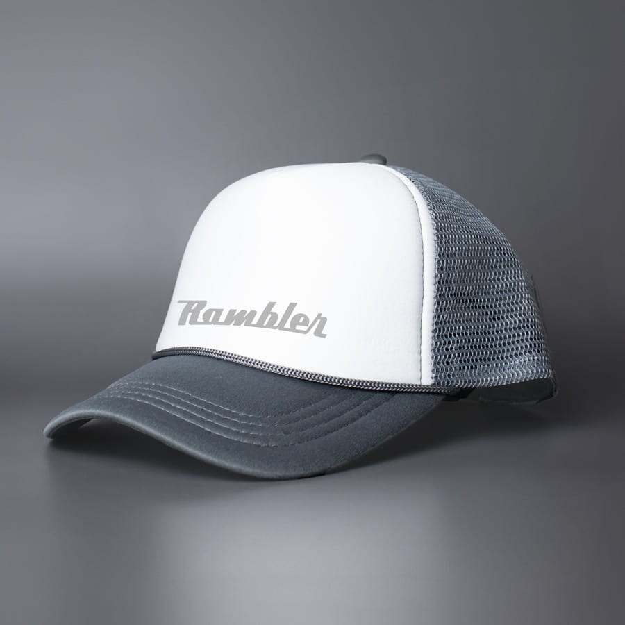 A grey and white trucker cap featuring a mesh back and a logo on the front.