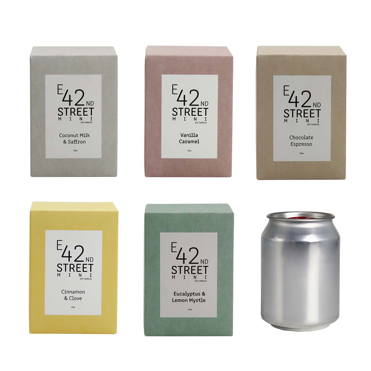 A collection of six candle boxes in various pastel colours, with a silver can candle among them. Each box has a logo.