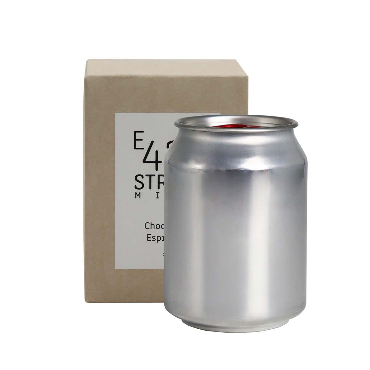 A silver can candle next to a light brown box. The candle has a minimalist design and is labelled as 