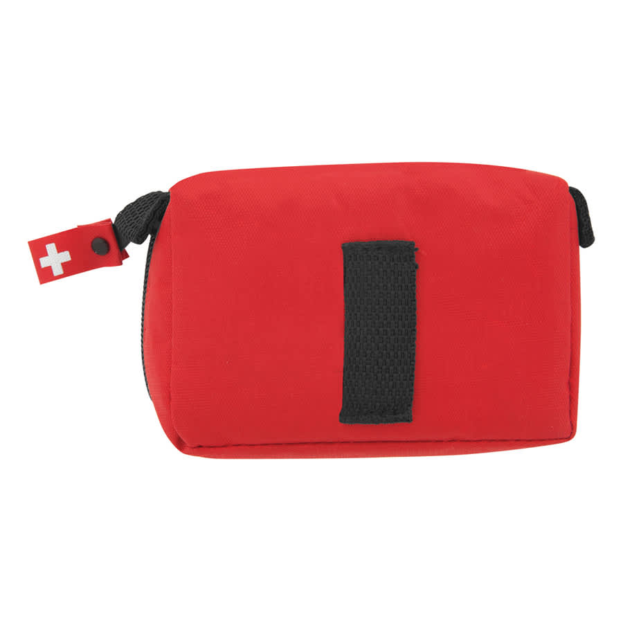 A red first aid travel kit with a zipper, featuring a small tag. Contains tools and supplies for basic medical needs.