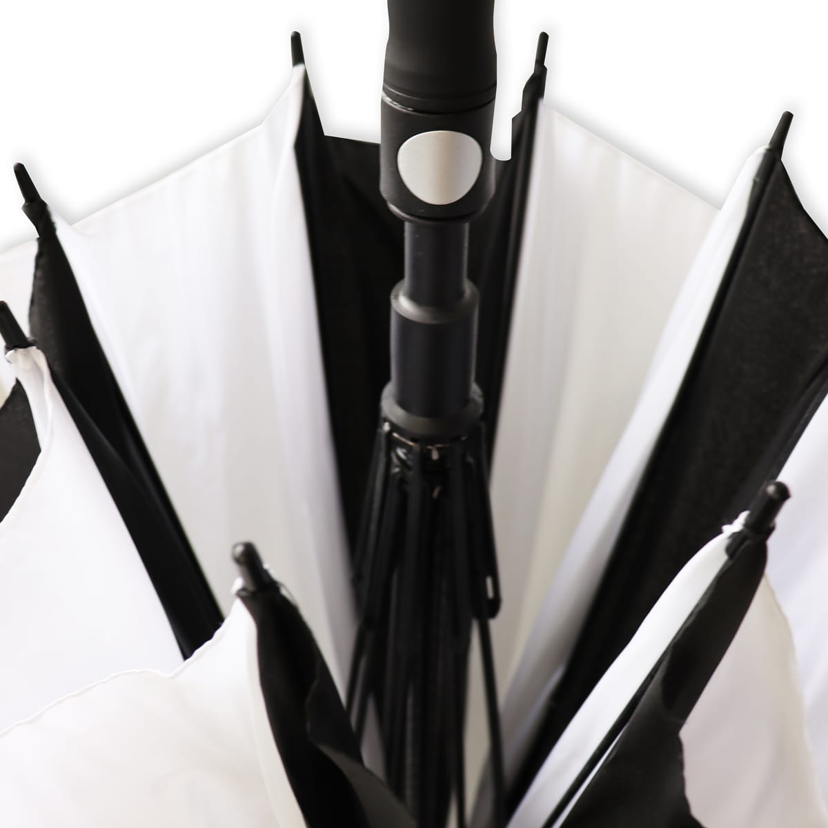 A black and white umbrella with a central handle, featuring a sleek design and a branding logo.