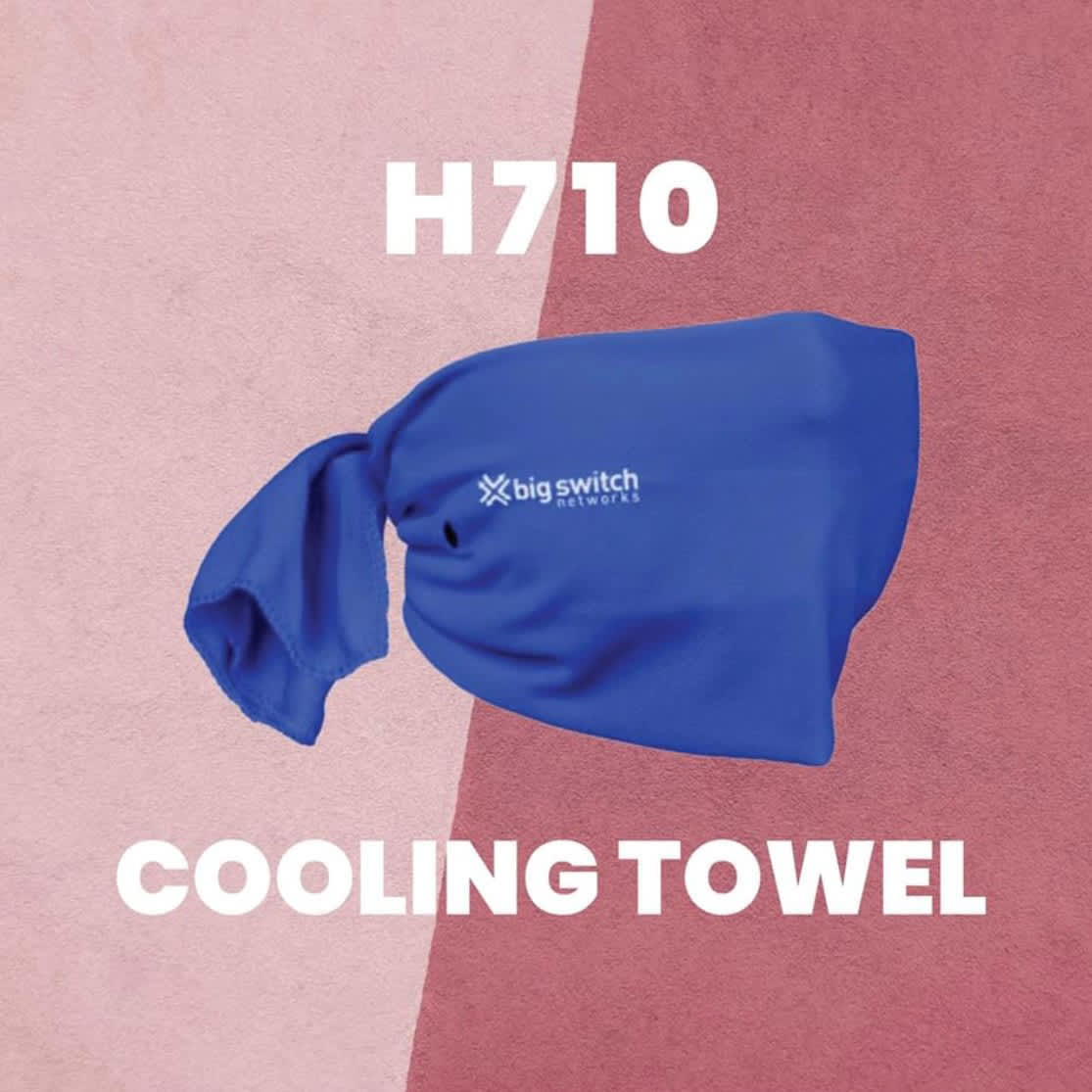 A blue cooling towel with a logo, displayed against a pink background.