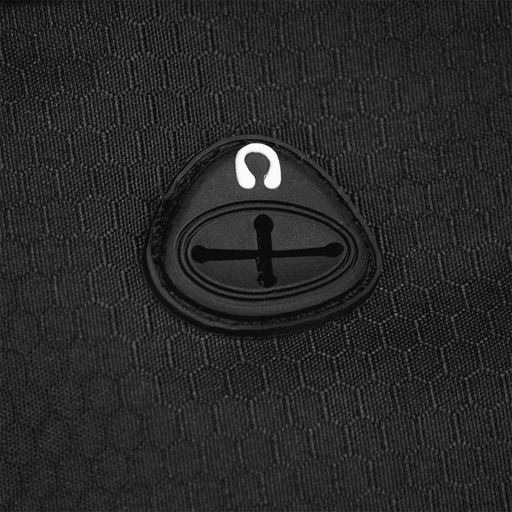 A black textured fabric featuring a distinctive oval-shaped logo.