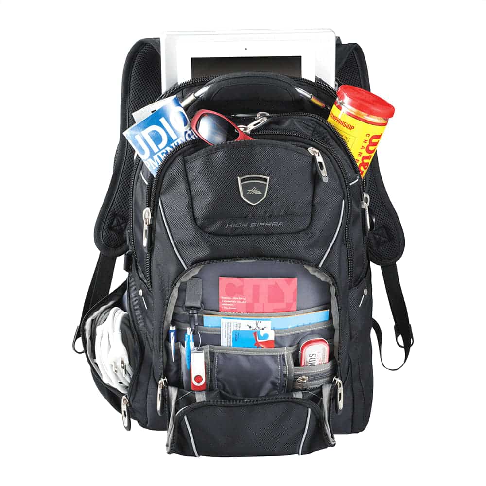 A black computer backpack with multiple compartments, featuring an iPad, snacks, and various organisational items.