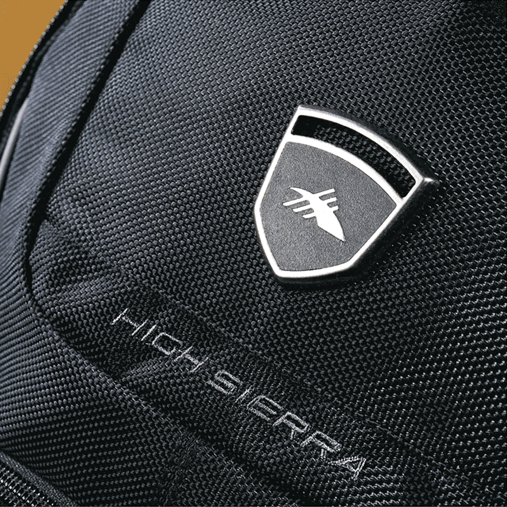 A black computer backpack with padded straps and mesh detailing, featuring multiple compartments and a logo.