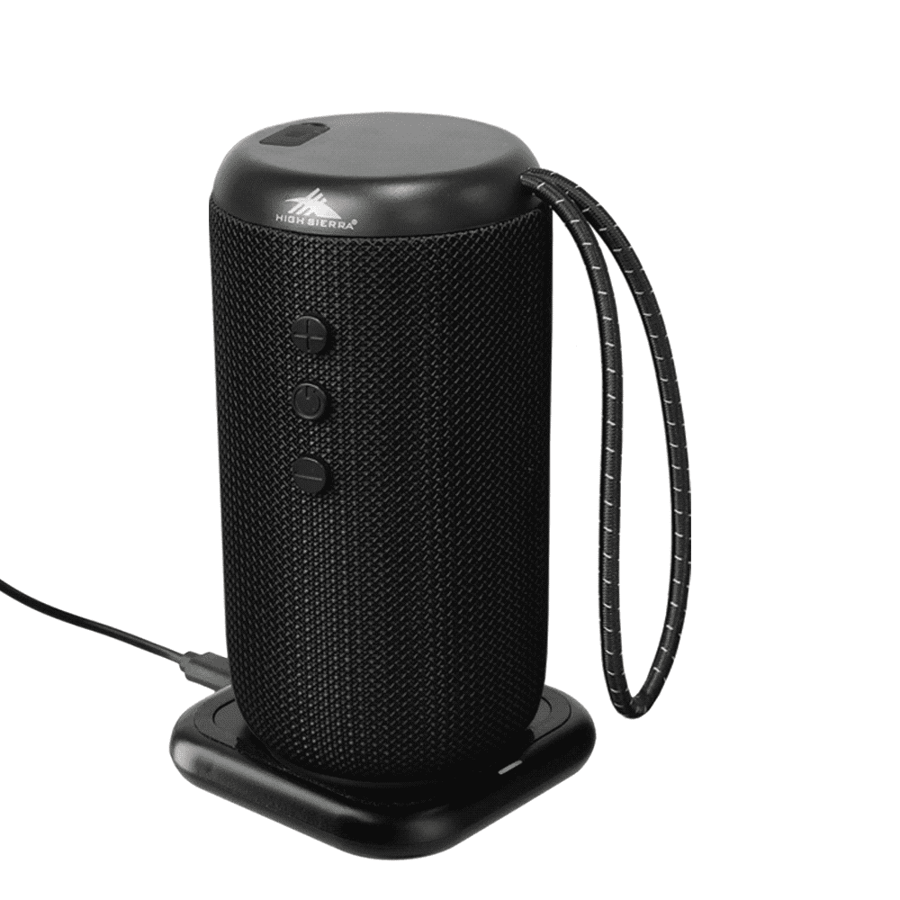 A black, cylindrical outdoor Bluetooth speaker with a textured surface and a handle, positioned on a charging dock.