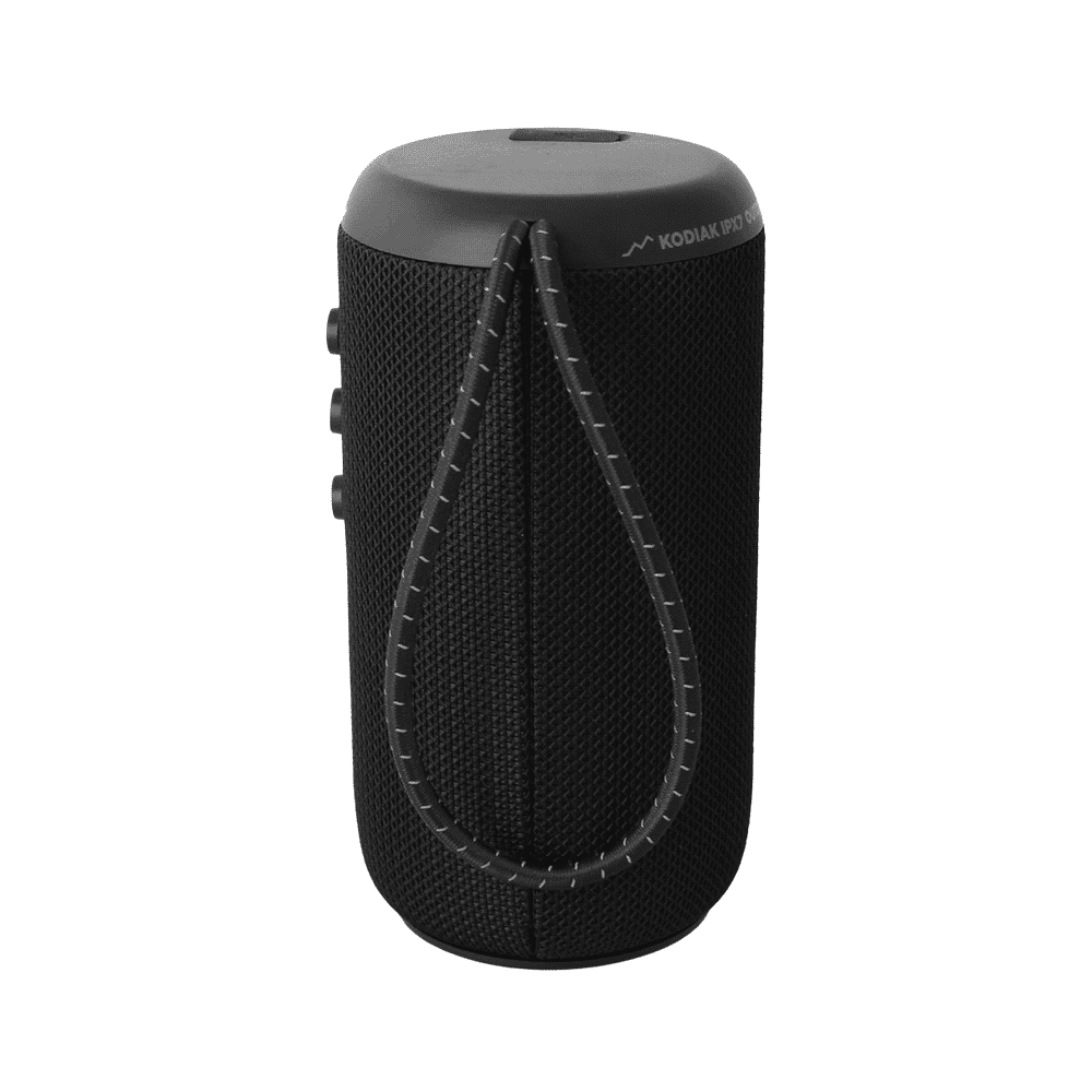 A black cylindrical Bluetooth speaker with control buttons and a phone displaying music playback beside it.