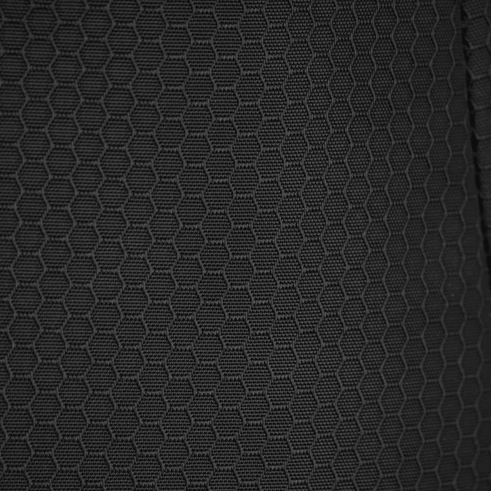 A textured black fabric featuring a hexagonal pattern, suitable for duffle bags and backpacks.