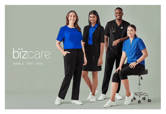 A promotional image featuring four models in blue and black uniforms, showcasing different styles and a logo.