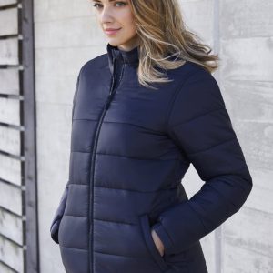 A women's puffer jacket in navy blue, featuring a zip front, side pockets, and a fitted design.