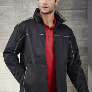 A black unisex jacket with white piping, featuring a zippered front and high collar. It has a logo on it.