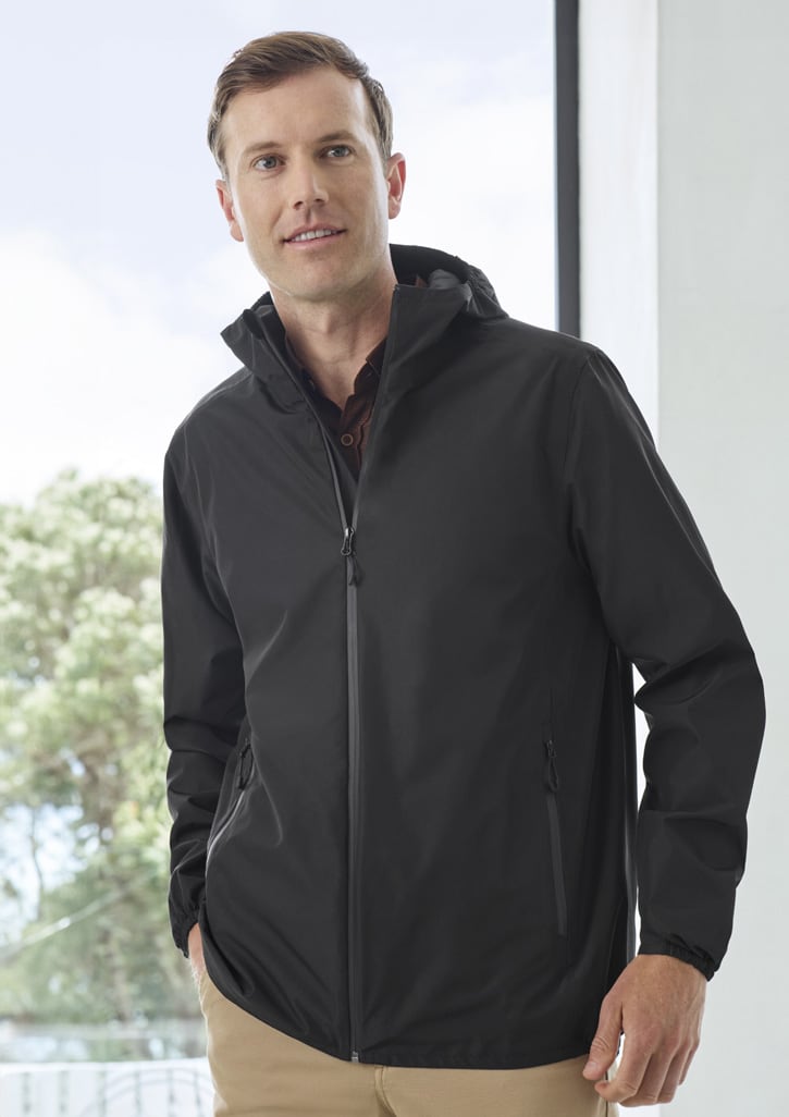 A man is wearing a black rain jacket with a hood, featuring zip pockets and a sleek design.