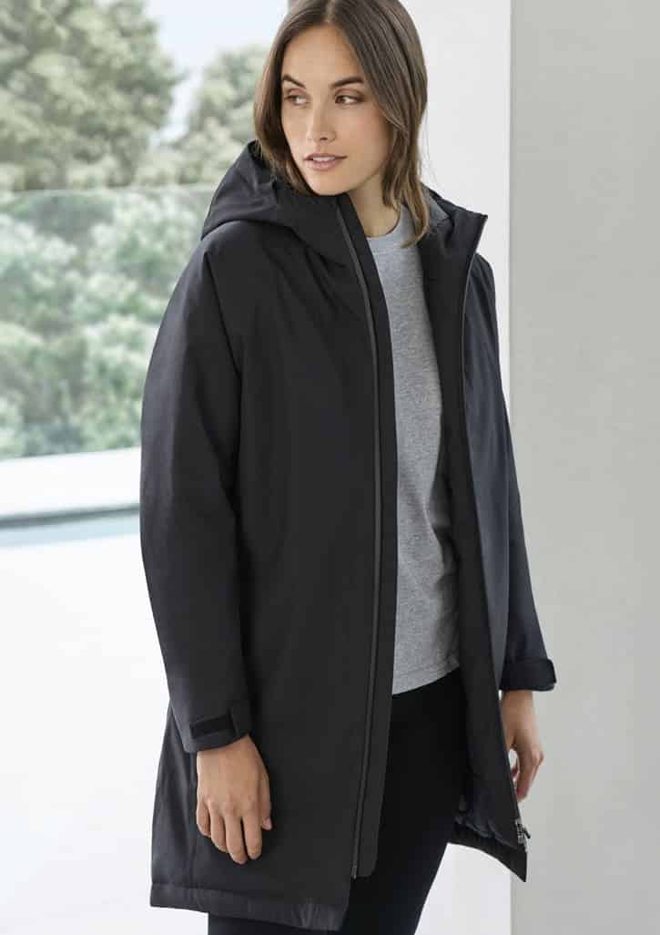 A black unisex rain jacket with a hood, featuring a simple design and a logo on the chest.
