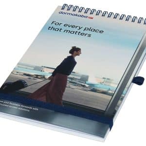 A top-bound A5 notebook with a spiral binding, featuring a blue and white cover design and a logo.