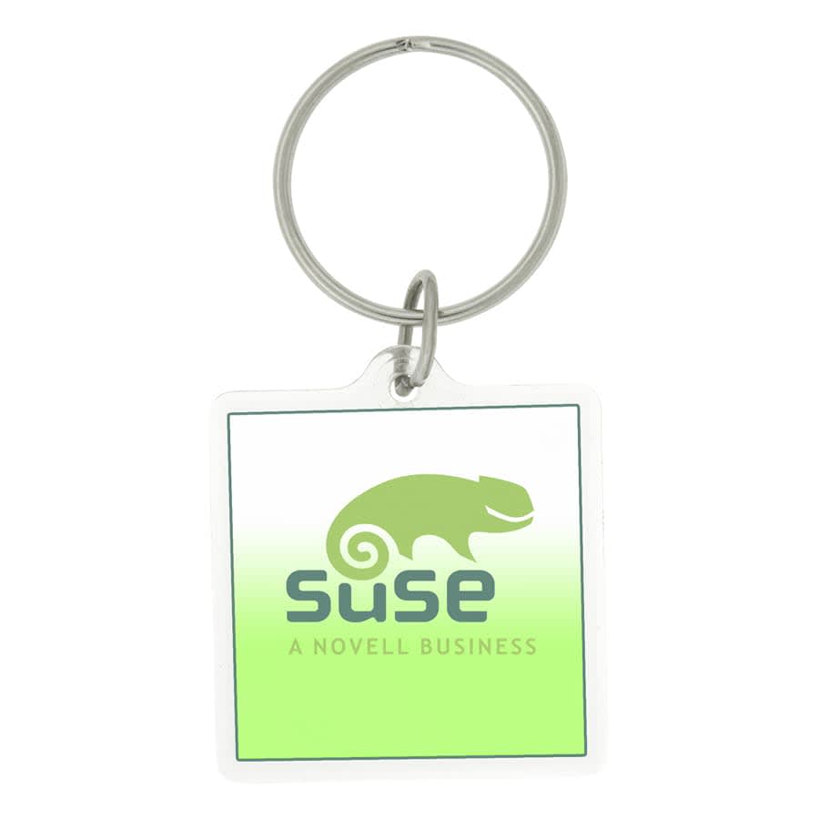 A square acrylic keychain with a clear border, featuring a logo and text in red and blue.