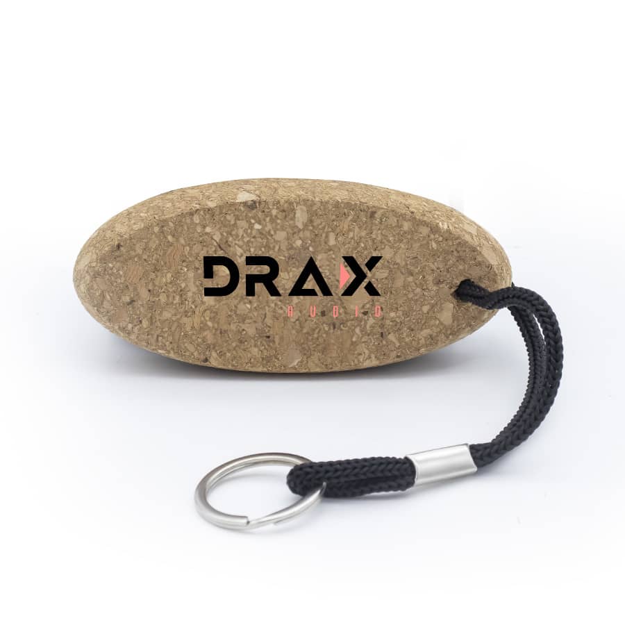 A cork keychain in an oval shape with a black rope attached and a metallic keyring. It features a logo.