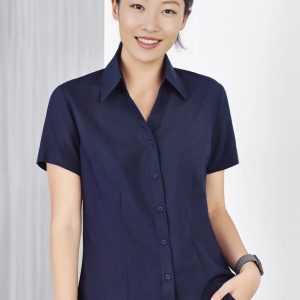 A navy plain short sleeve button-up shirt for women, featuring a collared neckline and a slim fit.