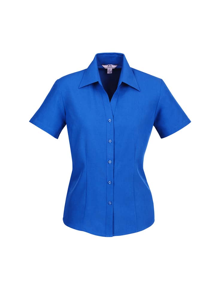 A blue short sleeve button-up shirt with a collar and a logo. The shirt features a tailored fit.
