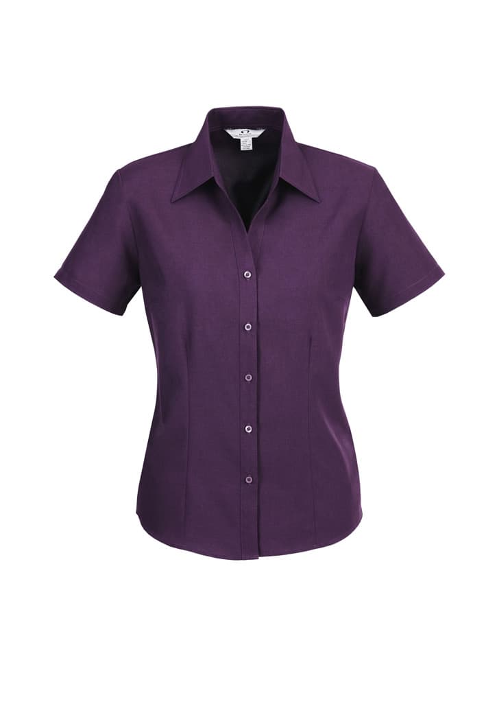 A purple short sleeve button-up shirt with a collared neckline and a fitted style, featuring a logo.