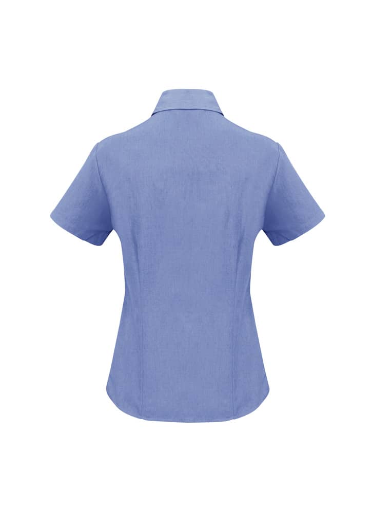 A blue short sleeve button-up shirt with a collar and a branded logo on the back.