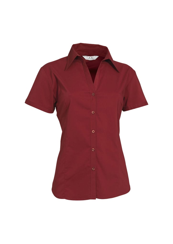 A maroon women's button-up shirt with short sleeves and a pointed collar, featuring a logo.